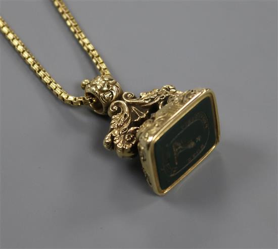 A 19th century yellow metal overlaid bloodstone fob seal, on a yellow metal box link chain, seal 32mm.
